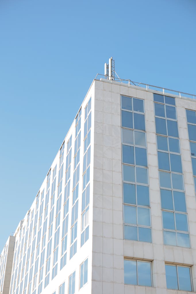 Contemporary glass facade of an office building in Arcueil, showcasing architectural symmetry.